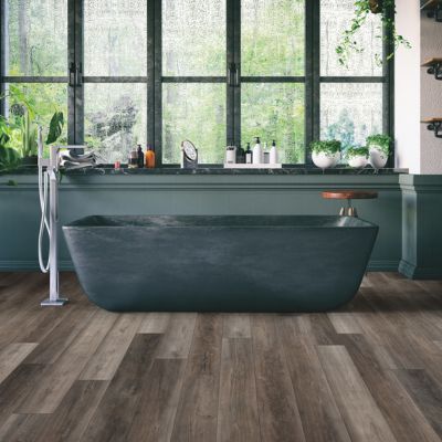 luxury vinyl plank flooring in a dark green NJ bathroom with tub