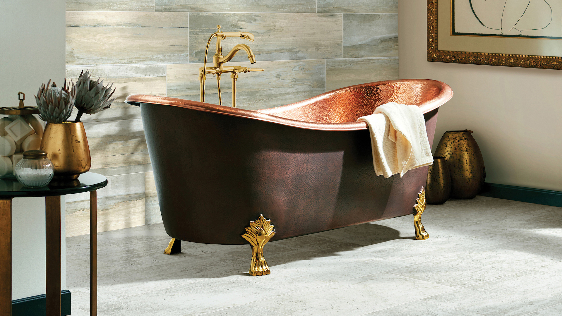 grey tile flooring in a spacious bathroom with a copper tub and wood look tile accent wall